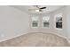 Bedroom featuring carpeted floors and multiple windows, allowing for plenty of natural light at 4171 Towncastle Ln, Buford, GA 30518