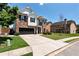 Beautiful two-story brick and white home featuring a two-car garage and a neatly landscaped front yard at 4171 Towncastle Ln, Buford, GA 30518