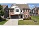 Charming two-story brick home with a well-manicured lawn and a two car garage at 4171 Towncastle Ln, Buford, GA 30518