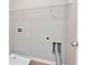 A functional laundry room featuring a utility sink, washer hookups, and dryer vent at 4171 Towncastle Ln, Buford, GA 30518