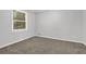 Neutral carpeted bedroom with natural light at 752 Roxboro Trce, Lawrenceville, GA 30044