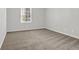 Bedroom with neutral carpet and window at 752 Roxboro Trce, Lawrenceville, GA 30044