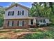 Charming two-story home featuring a brick facade and light gray siding at 752 Roxboro Trce, Lawrenceville, GA 30044