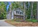 Two story home featuring a brick facade and light gray siding on a well landscaped lot at 752 Roxboro Trce, Lawrenceville, GA 30044