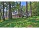 Traditional home with brick facade and dark shutters with lush landscaping at 752 Roxboro Trce, Lawrenceville, GA 30044
