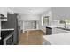 Bright kitchen featuring stainless steel appliances, lots of counter space and wood flooring at 752 Roxboro Trce, Lawrenceville, GA 30044