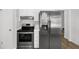 Kitchen featuring stainless steel appliances and white cabinets at 752 Roxboro Trce, Lawrenceville, GA 30044