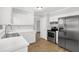 Bright kitchen with stainless steel appliances and white cabinets at 752 Roxboro Trce, Lawrenceville, GA 30044
