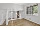 Living room with staircase, big window, and hardwood flooring at 752 Roxboro Trce, Lawrenceville, GA 30044