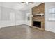 Cozy living room with a brick fireplace, tile flooring and white trim at 752 Roxboro Trce, Lawrenceville, GA 30044