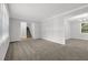 Spacious living room features neutral paint and plush carpet at 752 Roxboro Trce, Lawrenceville, GA 30044