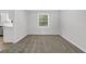 Spacious living room with big window and carpet flooring at 752 Roxboro Trce, Lawrenceville, GA 30044