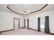 Large main bedroom featuring coffered ceilings, lots of light, and neutral carpet at 98 Country Acres Ct, Mcdonough, GA 30253
