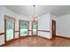 Bright dining area featuring hardwood floors, natural light, and views of the outdoors at 98 Country Acres Ct, Mcdonough, GA 30253