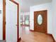 Foyer with hardwood floors, neutral paint, and decorative stained-glass front door at 98 Country Acres Ct, Mcdonough, GA 30253