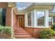 Charming brick home featuring well-maintained landscaping and an inviting front entrance at 98 Country Acres Ct, Mcdonough, GA 30253