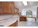 Open concept kitchen features wood cabinets, tiled floor, and views to the dining area at 98 Country Acres Ct, Mcdonough, GA 30253