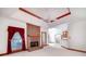 Living room showing fireplace, ceiling fan, and open concept connecting to the kitchen at 98 Country Acres Ct, Mcdonough, GA 30253