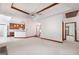 Open living area with kitchen, unique ceilings, carpeted floors, and wooden trim at 98 Country Acres Ct, Mcdonough, GA 30253