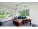 Cozy sunroom with vaulted ceilings, paneled walls, and lots of windows at 98 Country Acres Ct, Mcdonough, GA 30253