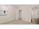 Bright bedroom with neutral carpet, window, and accessible doorway for comfort at 1626 Palladian Way, Lithonia, GA 30058