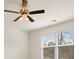 Bedroom with fan and window at 1626 Palladian Way, Lithonia, GA 30058