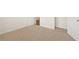 A bright bedroom with carpet, featuring two doors, enhancing privacy and accessibility at 1626 Palladian Way, Lithonia, GA 30058