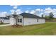 A single-story home with an attached garage surrounded by a well-maintained lawn at 1626 Palladian Way, Lithonia, GA 30058