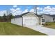 Well-maintained single-story home with an attached garage and lush green lawn at 1626 Palladian Way, Lithonia, GA 30058