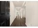 Inviting hallway with dark wood floors and white trim, leading to a bright and spacious living area at 1626 Palladian Way, Lithonia, GA 30058