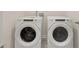 A convenient laundry room showcasing a modern washer and dryer set for efficient chores at 1626 Palladian Way, Lithonia, GA 30058