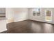 Open-concept living room with hardwood floors, and natural light at 1626 Palladian Way, Lithonia, GA 30058