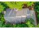 Aerial view of the house showing roof and driveway surrounded by trees at 4975 Duncans Lake Dr, Buford, GA 30519