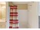 Bathroom features shower/tub combo with colorful curtain and neutral color scheme at 4975 Duncans Lake Dr, Buford, GA 30519