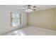 Bedroom featuring neutral walls, ceiling fan and window at 4975 Duncans Lake Dr, Buford, GA 30519