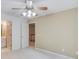 Bright bedroom featuring a ceiling fan, neutral paint, and plush carpeting at 4975 Duncans Lake Dr, Buford, GA 30519