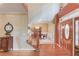 Foyer with hardwood floors, staircase, dining room archway and decorative glass entry door at 4975 Duncans Lake Dr, Buford, GA 30519