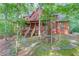 Secluded brick home with a charming front porch, stone accents, and inviting stairway at 4975 Duncans Lake Dr, Buford, GA 30519