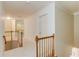 Hallway featuring wooden railing and trim at 4975 Duncans Lake Dr, Buford, GA 30519