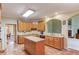 Well-equipped kitchen features an island, granite countertops, and tile flooring at 4975 Duncans Lake Dr, Buford, GA 30519