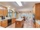 Bright eat-in kitchen with a central island, modern appliances, and lots of windows at 4975 Duncans Lake Dr, Buford, GA 30519