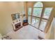 Bright living room with fireplace, two-story window, and ceiling fan at 4975 Duncans Lake Dr, Buford, GA 30519