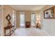 Bright living room with neutral walls, carpet, lots of natural light, and decorative furniture at 4975 Duncans Lake Dr, Buford, GA 30519