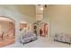 Bright open-concept living room with staircase and views of the kitchen at 4975 Duncans Lake Dr, Buford, GA 30519