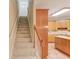 Carpeted staircase leads to the upper level, adjacent to the kitchen area at 4975 Duncans Lake Dr, Buford, GA 30519