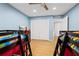 Bedroom featuring hardwood floors, ceiling fan and view of connected bathroom at 6851 Roswell Rd # E4, Atlanta, GA 30328