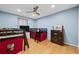 Light blue bedroom with wood floors featuring bunk beds and a ceiling fan at 6851 Roswell Rd # E4, Atlanta, GA 30328