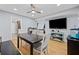 Open dining room with ceiling fan, wood floors, and access to other living spaces at 6851 Roswell Rd # E4, Atlanta, GA 30328