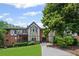 Charming condo exterior showcasing brick facade, multiple balconies and inviting front yard at 6851 Roswell Rd # E4, Atlanta, GA 30328