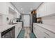 Bright kitchen featuring modern white cabinets, stainless steel appliances, and stylish countertops at 6851 Roswell Rd # E4, Atlanta, GA 30328